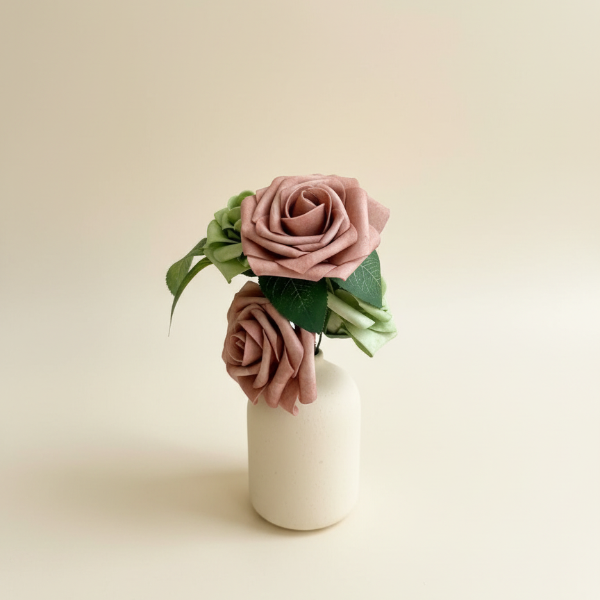 Dusty rose arrangement with cream background